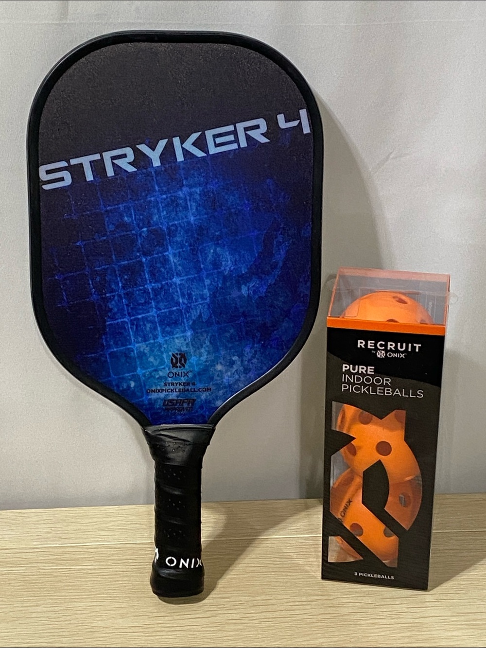 Onix Stryker 4 Pickleball Paddle with Orange Indoor Balls